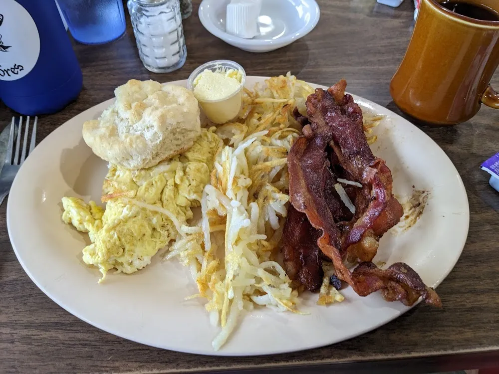 Two Eggs Any Style Hash Browns Bacon and a Biscuit